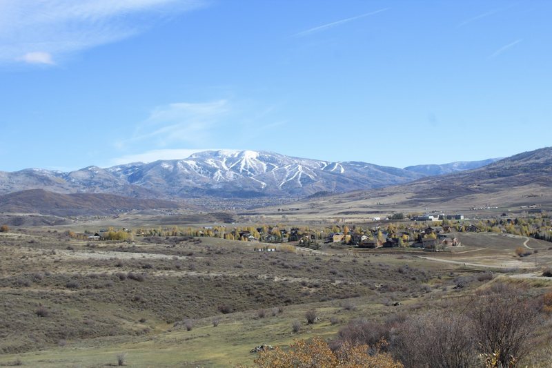 Snow-capped range above a valley town