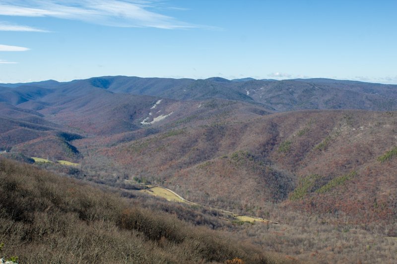 Wide valley of rolling, autumn-colored mountains