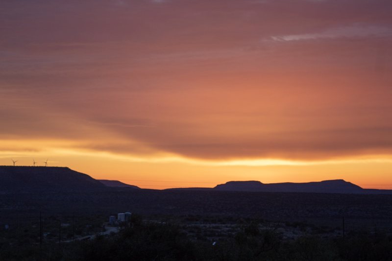 Orange glow over a mountain ridge